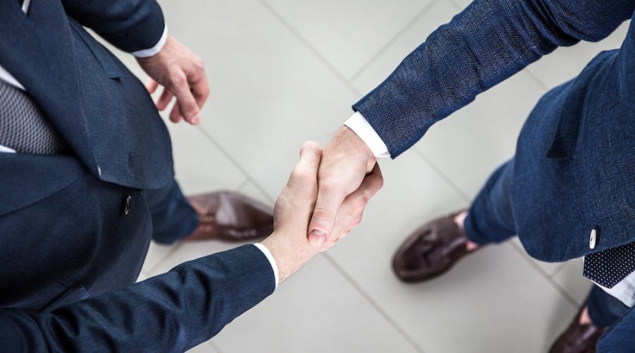 Business people shaking hands, finishing up a meeting